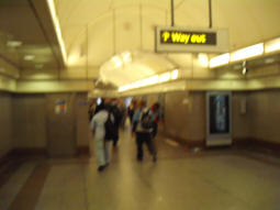 A fuzzy picture taken at the top of the lower, shorter escalator. The longer escalator is along the corridor around the corner (June 2009)