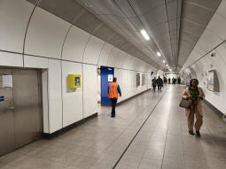 Looking towards the escalators to Monument station from by the Northern line northbound platform. The old stairs down to the DLR, largely replaced by a new bank of escalators, can also be seen on the left