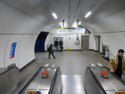 At the bottom of the escalators from the Central line, heading to the Northern, District and Circle lines and the DLR