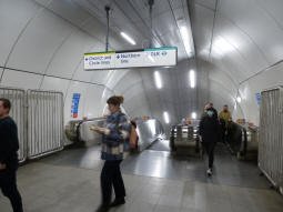 Escalators down to the Northern, District and Circle lines and the DLR from between the Central line platforms