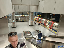 Looking down to the platforms from an escalator up to the ticket hall