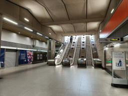 Escalators to the street from the ticket hall