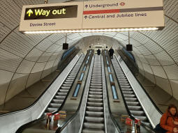 Looking up the escalators from between the Elizabeth line platforms towards the Davis Street exit and the Underground