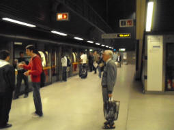 Slightly fuzzy picture showing the Eastbound platform with a train just arriving (June 2009)