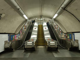 Escalators and stairs up to the eastbound platform and onwards to the exit from just off the westbound platform
