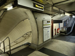 At the top of the stairs down to the Bakerloo line southbound platform the escalator up to the upper interchange level can also be seen