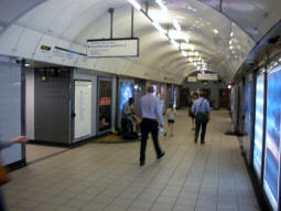 At the bottom of the escalators to the Victoria line and Northern line Bank branch southbound platforms