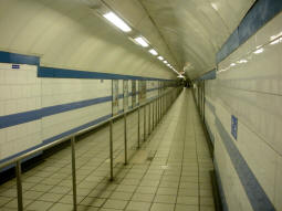 Looking along the tunnel from the Victoria line to the Piccadilly and Jubilee lines