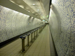 Looking along the tunnel from the Victoria and Piccadilly lines to the Jubilee line