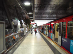 The platform for trains to Lewisham, with a Lewisham-bound train waiting to depart (June 2009)