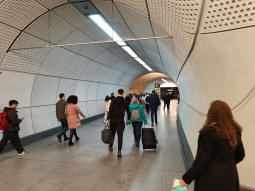 Looking through from the eastbound Elizabeth line platform to the passageway between the platforms and beyond that the westbound platform