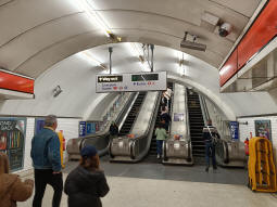 Escalators to the part-time Central line ticket hall from between the Central line platforms