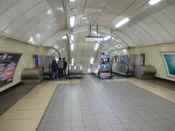 The escalators and stairs down to the Northern line from the intermediate level