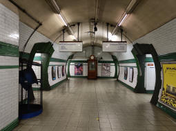 Between the platforms at the bottom of the escalators and stairs from the ticket hall