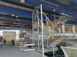 Stairs up to the platforms with the nearest going to the island platform for trains to Bank and Stratford