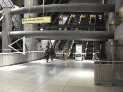 At eastbound Jubilee line level (you can just see the platform-edge doors near the left of the picture) we see the lift and the escalators to the District and Circle lines (multiple photos stitched together)
